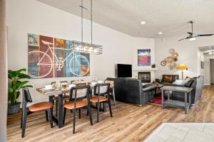 a living room with a table and chairs and a dining room at Cottonwoods 347 in Moab