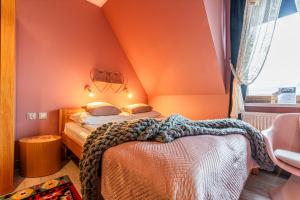 Posteľ alebo postele v izbe v ubytovaní Folkowy Dworek SPA & Fun