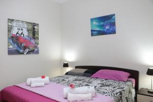 Postel nebo postele na pokoji v ubytování The Maze Vibo B&B