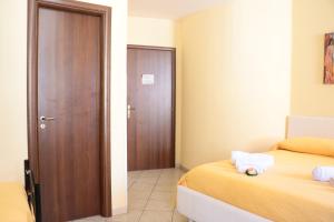Postel nebo postele na pokoji v ubytování The Maze Vibo B&B