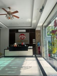 a lobby of a hotel with a ceiling fan at Phương Đông Hotel and Apartment in Hai Phong