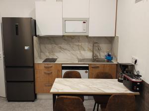 Kuchyň nebo kuchyňský kout v ubytování Apartamento Cervantes 2 + 9 fotografií