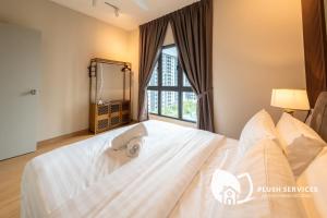 Maya Bay Residences at Gamuda Cove, Dengkil by Plush客房内的一张或多张床位