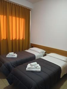 Postel nebo postele na pokoji v ubytování Hotel Ponsacco HP