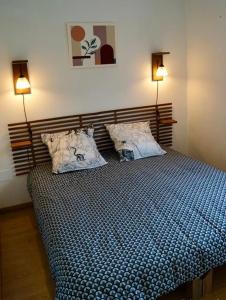 Ένα ή περισσότερα κρεβάτια σε δωμάτιο στο Appartement T2 Ste Marie de Campan - La Mongie - Tourmalet
