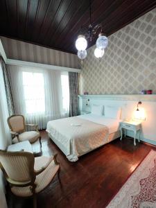 Postel nebo postele na pokoji v ubytování Bursa İpekyolu Hotel