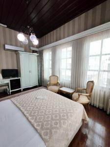 Postel nebo postele na pokoji v ubytování Bursa İpekyolu Hotel