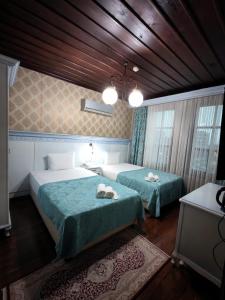 Postel nebo postele na pokoji v ubytování Bursa İpekyolu Hotel