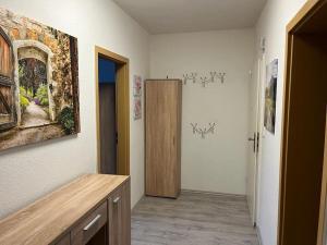 a room with a hallway with a wooden door at Monteurwohnung in Marl - Schiller - 2OGL in Marl
