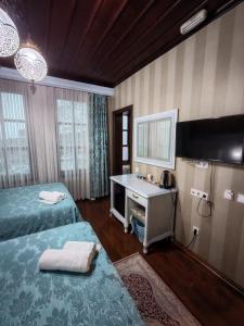 Postel nebo postele na pokoji v ubytování Bursa İpekyolu Hotel