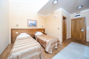 Postel nebo postele na pokoji v ubytování Hotel Stella di Mare