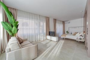 TV a/nebo společenská místnost v ubytování Santa Lucia Suites