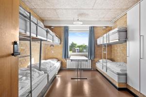 Voodi või voodid majutusasutuse Sæby Spektrum & Hostel toas