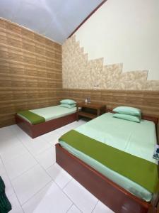 Letto o letti in una camera di ADA Homestay