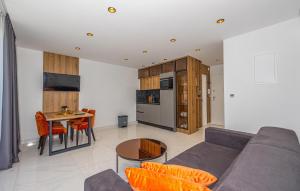 a living room with a couch and a table at Lovely Apartment In Crikvenica in Crikvenica