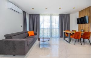 a living room with a couch and a table at Lovely Apartment In Crikvenica in Crikvenica