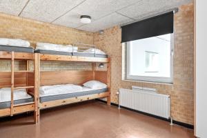 Voodi või voodid majutusasutuse Sæby Spektrum & Hostel toas