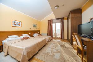 TV a/nebo společenská místnost v ubytování Hotel Stella di Mare