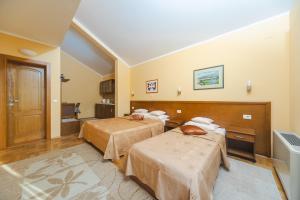 Postel nebo postele na pokoji v ubytování Hotel Stella di Mare