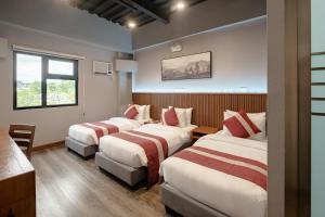 Postel nebo postele na pokoji v ubytování Kekehyu Business Hotel + 34 fotografií