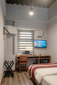 Postel nebo postele na pokoji v ubytování Kekehyu Business Hotel