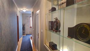 a hallway with a clock on a wall at Residence Dream in Rovinj