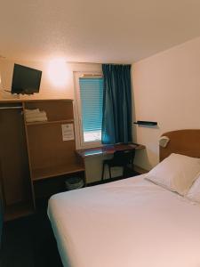 Postel nebo postele na pokoji v ubytování Quick Palace Saint Brieuc + 11 fotografií