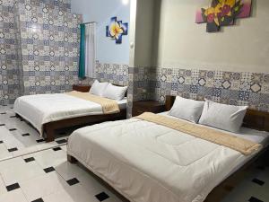 Letto o letti in una camera di ADA Homestay