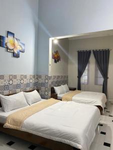 Letto o letti in una camera di ADA Homestay