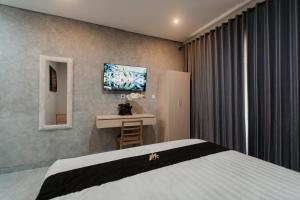TV a/nebo společenská místnost v ubytování Kelating Dream Guest House