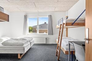 Voodi või voodid majutusasutuse Sæby Spektrum & Hostel toas