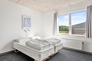 Voodi või voodid majutusasutuse Sæby Spektrum & Hostel toas