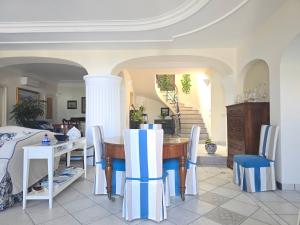a dining room with a table and chairs at La Spiga in Capri