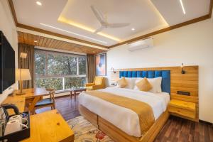 Ένα ή περισσότερα κρεβάτια σε δωμάτιο στο Echor Baris Resort Mussoorie