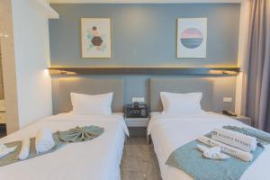 Postel nebo postele na pokoji v ubytování Bohol Panglao Begonia Resort