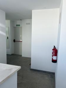 a fire hydrant is sitting on the wall of a room at Habitación En Casa de Familia Room in family home Solamente para personas tranquilas Only quiet people in Marbella +14 photos