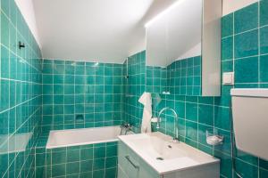 Koupelna v ubytování Stadtbauernhof Salzburg - Ferienwohnung - Gut Unterleithen