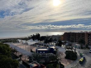 a view of a city with the ocean in the background at AGH Canet in Canet de Berenguer