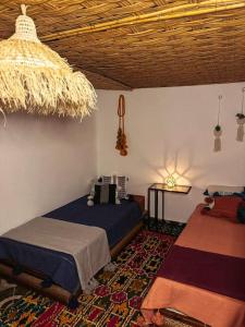 Postel nebo postele na pokoji v ubytování Berber Riad Villa Aourir Agadir
