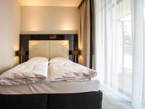 Posteľ alebo postele v izbe v ubytovaní VacationClub - Diune Hotel Apartament 115