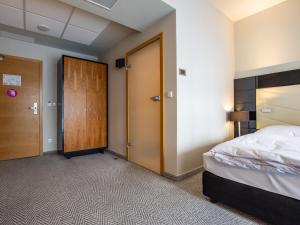 Posteľ alebo postele v izbe v ubytovaní VacationClub - Diune Hotel Apartament 115 + 15 fotografií