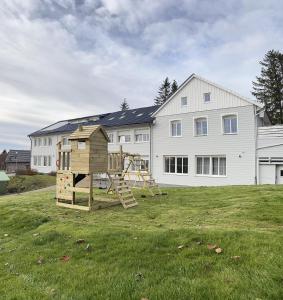 a playground in a yard in front of a house at Lieblingsquartier komplett in Sankt Andreasberg
