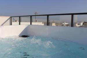 a swimming pool with water in it at Hacienda Club Benalup in Benalup Casas Viejas +45 photos