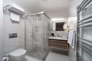 a bathroom with a shower and a toilet and a sink at Me by Mula in Istanbul +37 photos