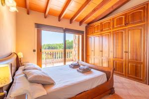 Ένα ή περισσότερα κρεβάτια σε δωμάτιο στο Finca Sa Estepa by Mallorca House Rent +24 φωτογραφίες