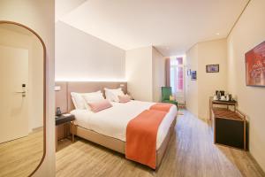 Cama ou camas em um quarto em Hotel Moon & Sun Braga mais 37 fotos