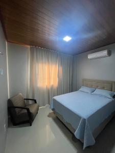 En eller flere senge i et værelse på Apartamento Sapucaia 42125