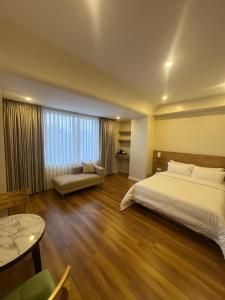 Tempat tidur dalam kamar di Hotel snowlion