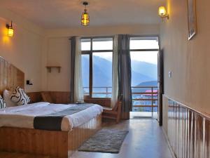 Voodi või voodid majutusasutuse Bayith Cafe and Stay toas