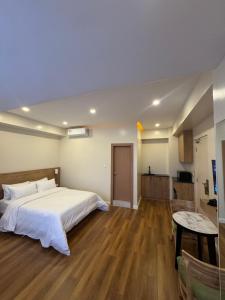 Tempat tidur dalam kamar di Hotel snowlion